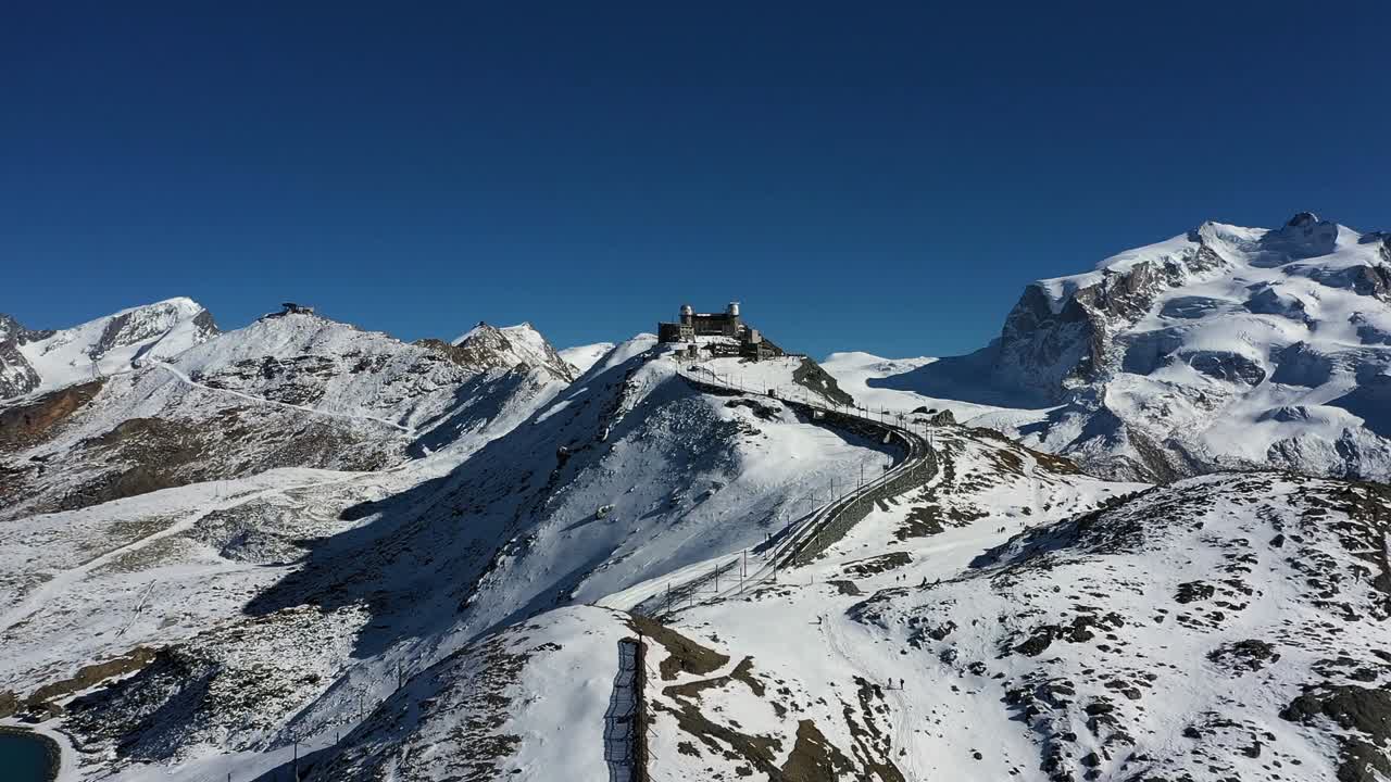 Mountain train station in Zermatt, Switzerland. Matterhorn. drone shot. Winter
