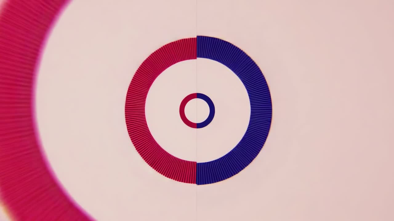 At start two animated concentric rings in red and blue counter rotating on beige pulsing aligning