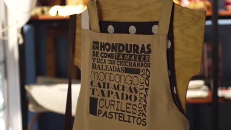 souvenir shop with traditional honduran cultural items, kitchen apron