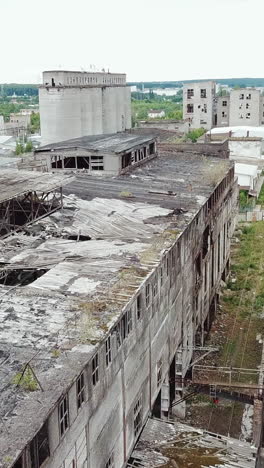 abandoned ruined industrial factory building, ruins and demolition concept. aerial view. vertical video