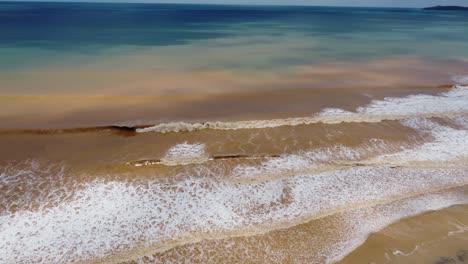 Aerial-View-of-waves-of-mud-on-a-beach-after-a-massive-storm