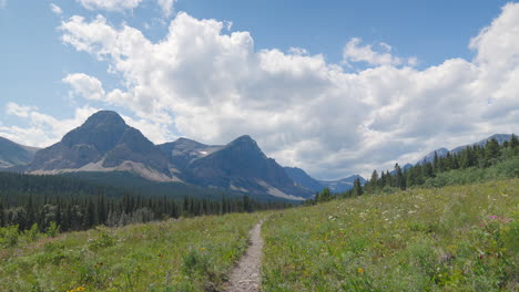 dramatic timelapse of meadows and mountains at glacier national park, montana