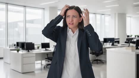 stressed and tensed indian female manager thinking