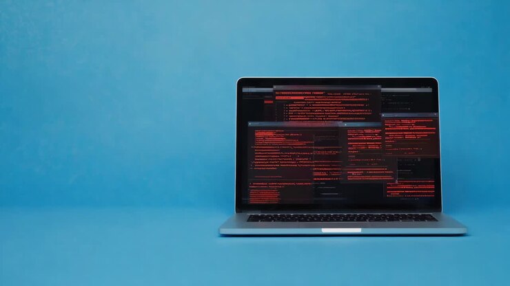 Laptop che mostra codice di programmazione su sfondo blu