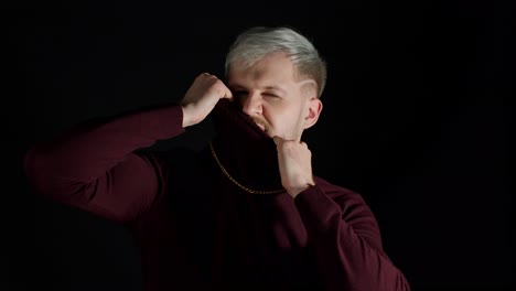 stylish man with blue eyes in trendy clothes looking at camera, feeling happiness, fun, enjoyment