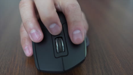 close up of hand using bluetooth mouse