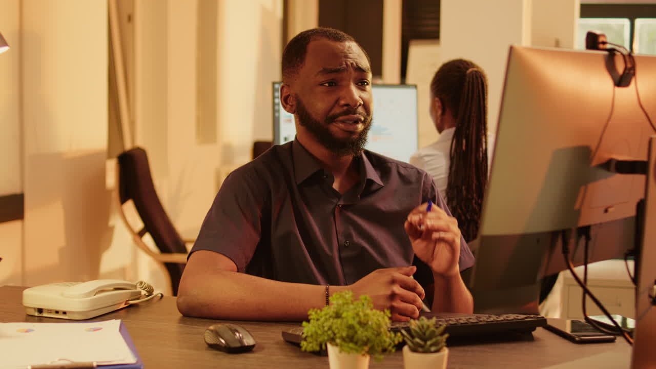 Man working at a computer in an office