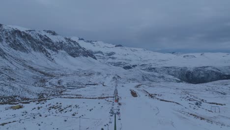 Aerial-shot-overhead-a-Ski-Lift-after-hours-at-El-Colorado,-Anden-Mountain-Range