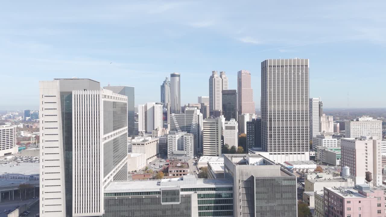 Aerial view of downtown Atlanta, Georgia, showcasing a vibrant skyline with tall skyscrapers, modern architecture, and urban development.