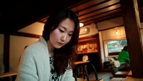 woman sitting in a cozy cafe