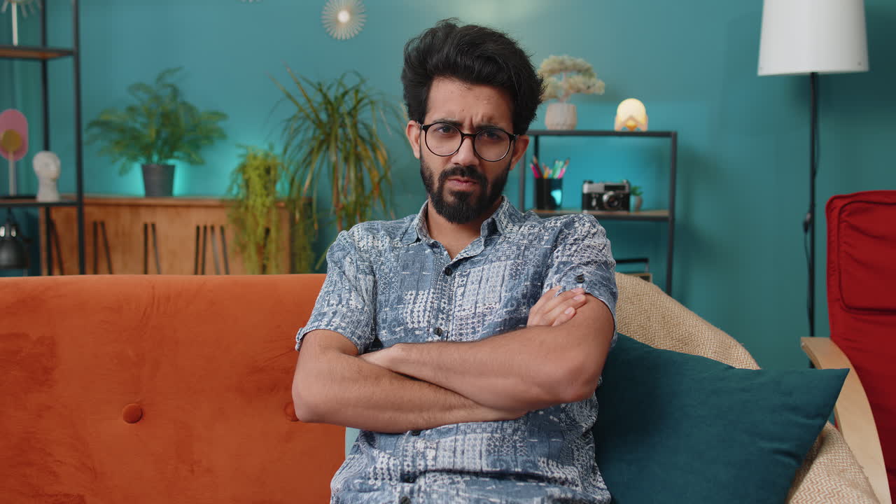 Displeased indian man reacting to unpleasant awful idea dismiss bad idea wave hand shake head no
