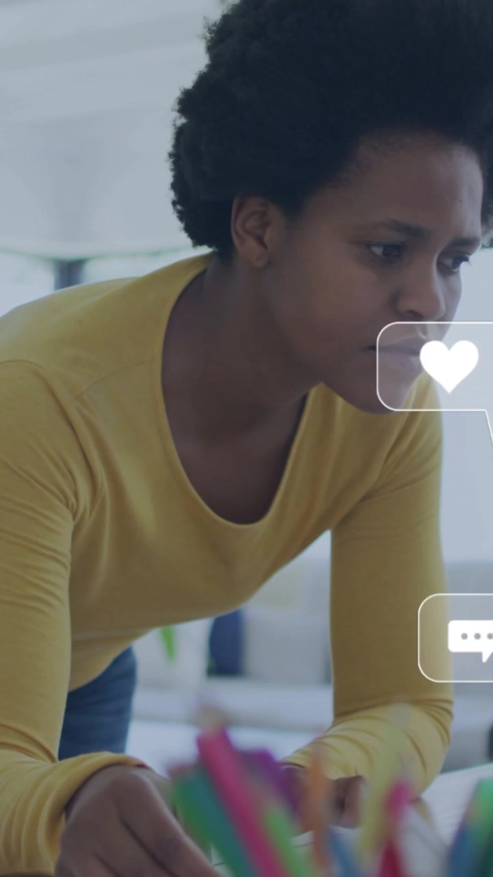 Vertical video: Woman leaning reading paper, making social icons swarm around her, tracking metrics