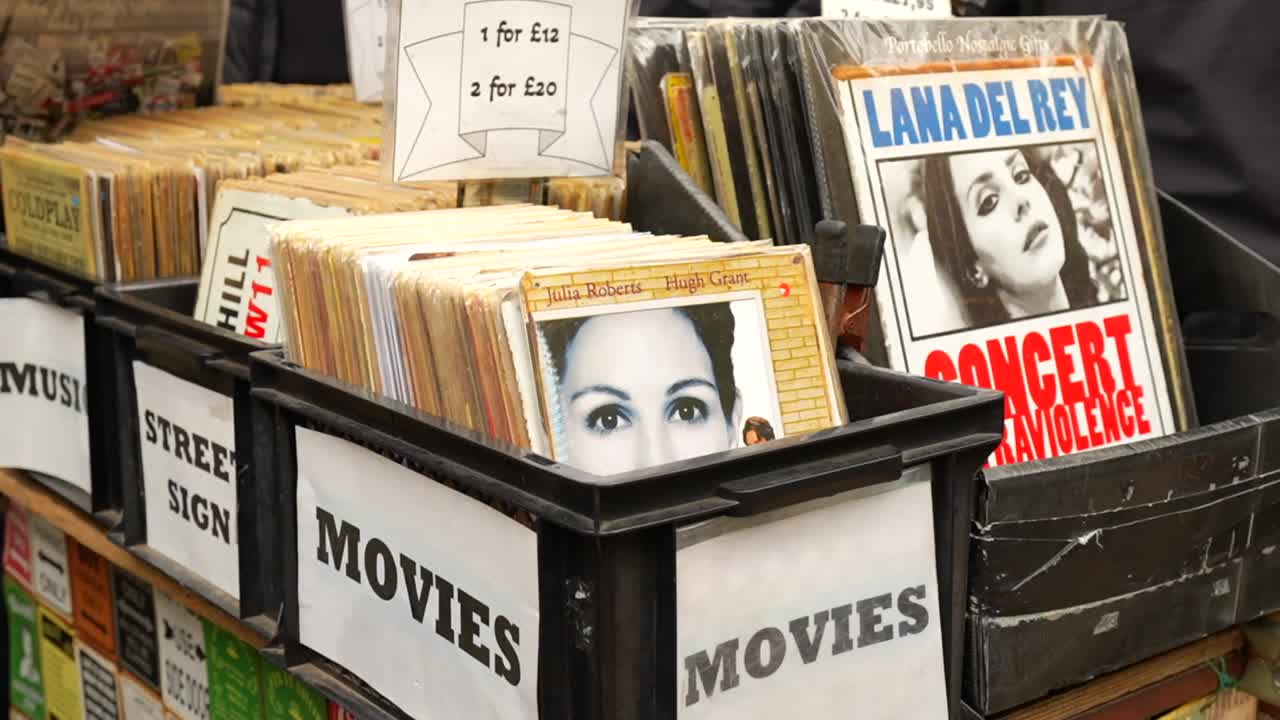 Vinyl records and vintage movie posters displayed at Portobello Road Market in Notting Hill, London