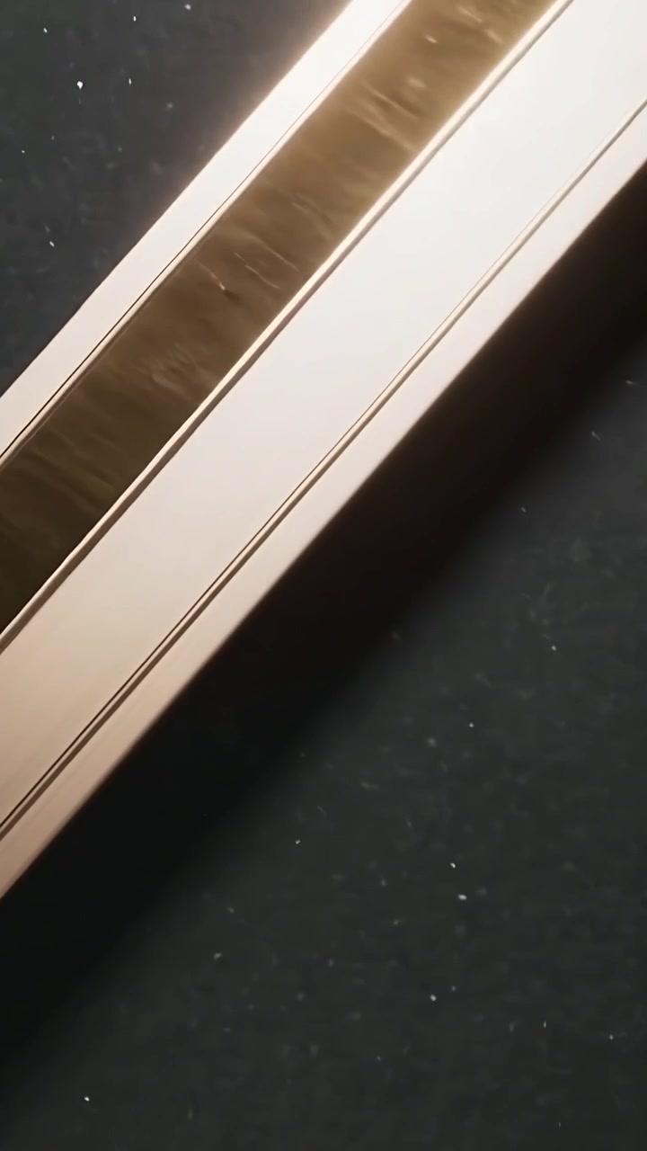 Vertical video: Panning camera revealing gold mouldings and maroon velvet on dark fabric for review