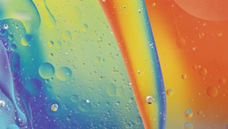 animation of bubbles moving on blue and yellow liquid with copy space