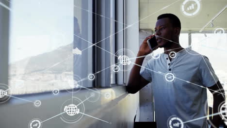 Animation-of-network-of-connections-over-african-american-man-talking-on-smartphone