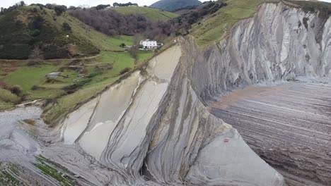 aerial drone view of the coast flysch structure in the beach of sakoneta in the basque country