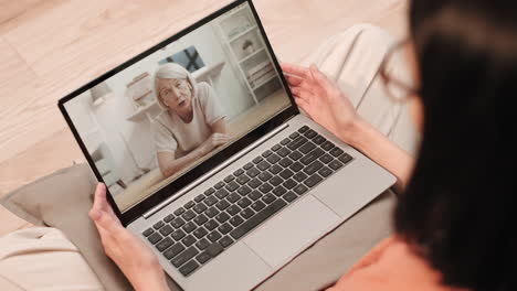 person watching woman talking on screen