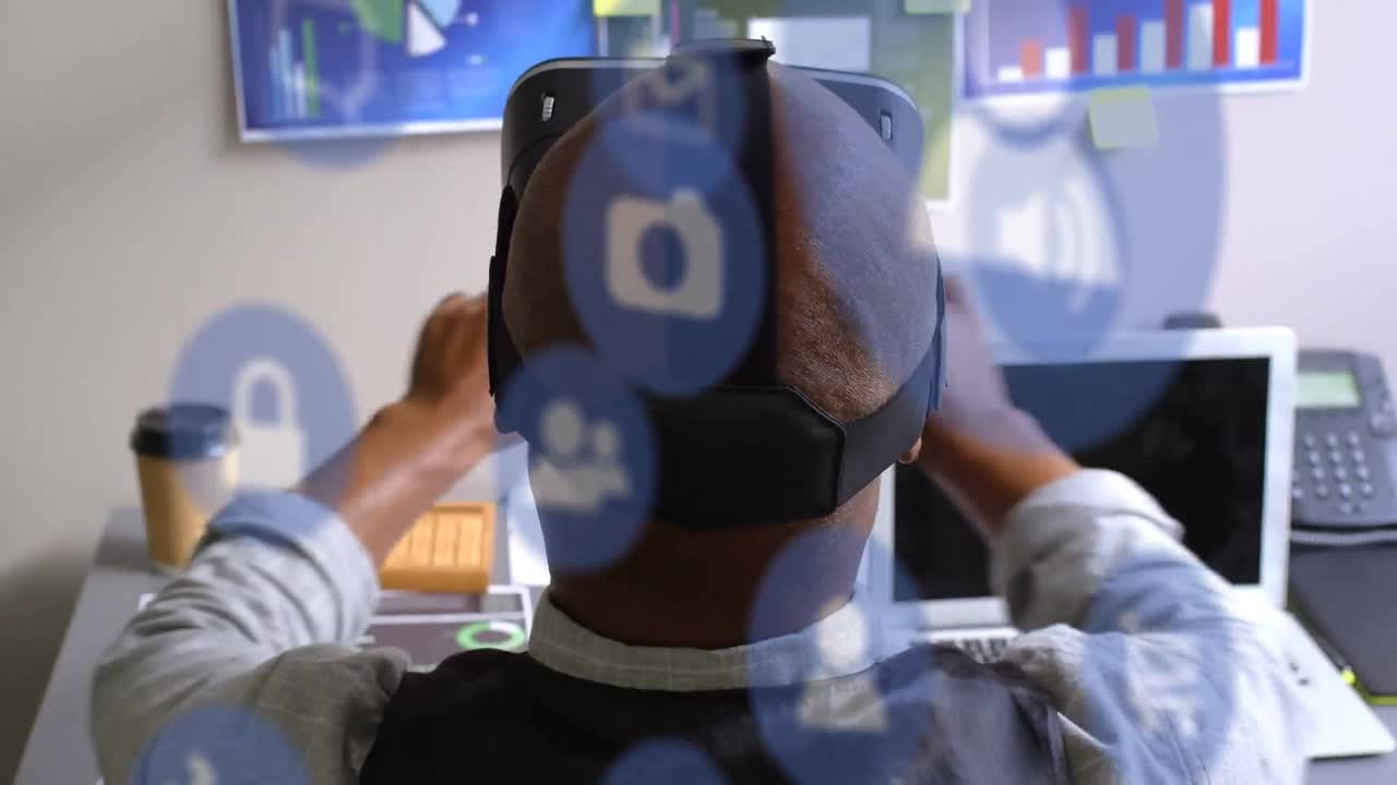 Animation of digital icons over caucasian businessman wearing vr headset