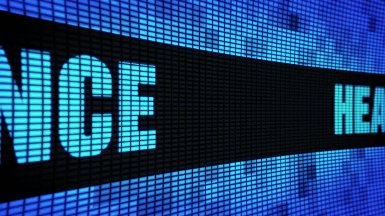 Health insurance side text scrolling on light blue digital led display board pixel light screen