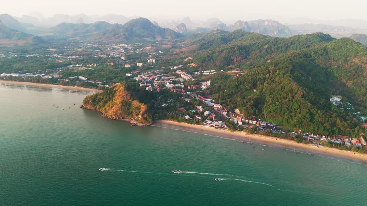 Enjoy a beautiful frontal view of Ao Nang Beach in Krabi, with boats gently floating on the crystal-clear water. The golden sand and lush surroundings create a peaceful tropical escape.