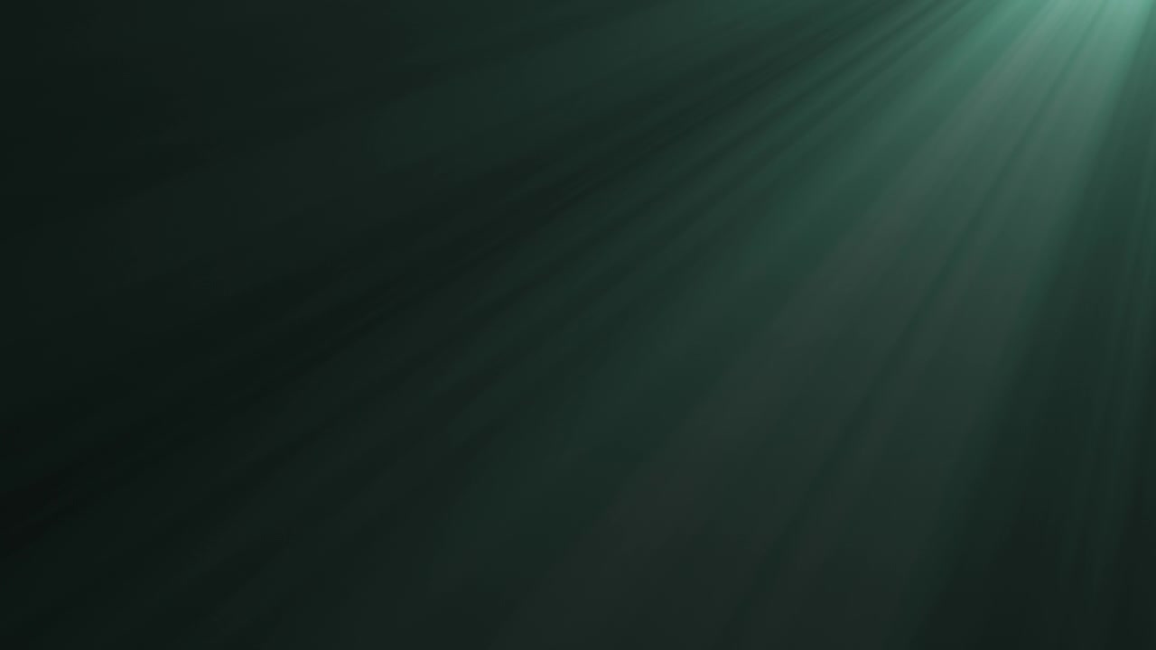 Soft Green Light Rays Shining Through Dark Background