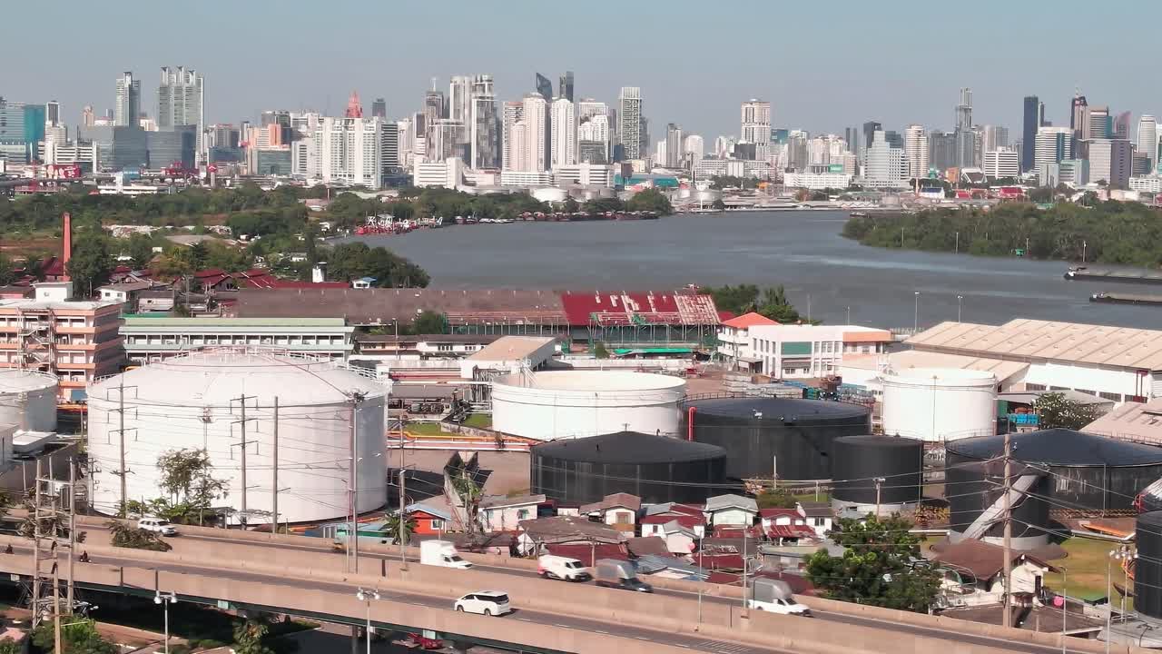 View of Bangkok's skyline and industrial area along the river