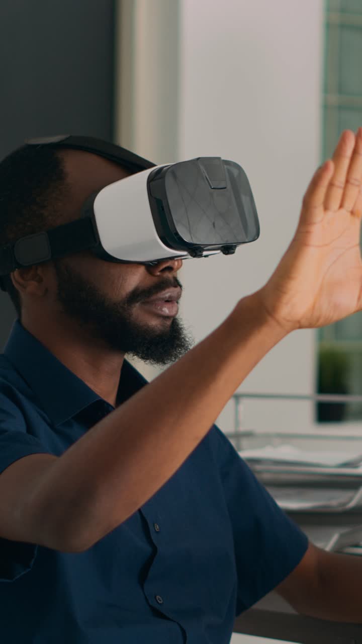 Vertical video: Database admin working with virtual reality glasses to develop server app