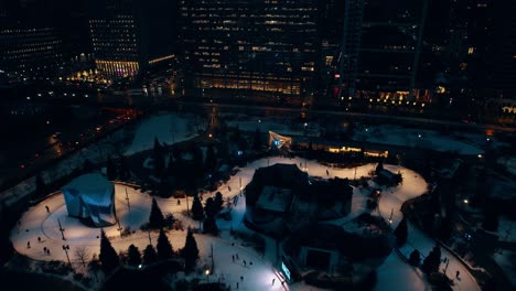 maggie daley skating ribbon ice skating aerial in chicago, illinois, usa 4k - winter time