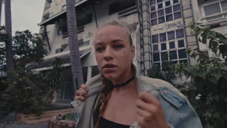 woman in a denim jacket in an urban setting
