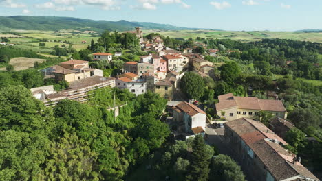 charming aerial view of lorenzana, italy, surrounded by lush greenery and rolling hills