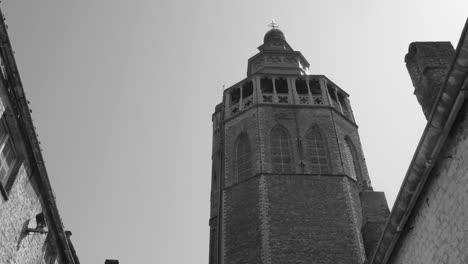 black and white shot of jerusalem chapel in bruges, belgium on a sunny day
