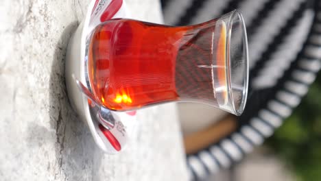 turkish tea in a glass cup on a patio