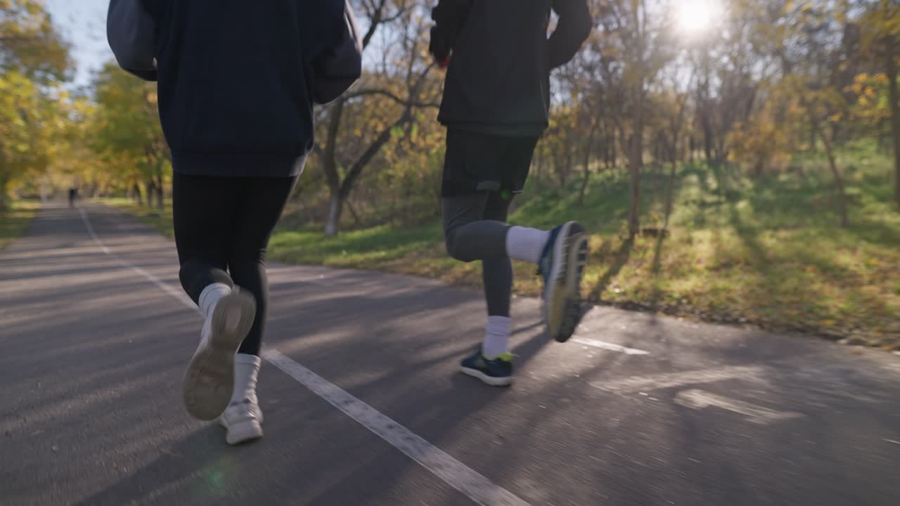 Couple Running in Autumn Park