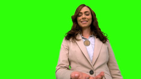 businesswoman throwing a coin in the air on green screen