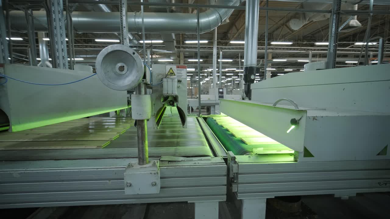Industrial Wood Processing Machine Moving Planks on Conveyor Belt in Factory