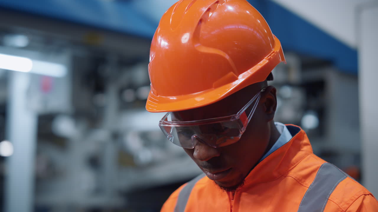 Closeup supervisor working facility in uniform. Manufacturing industry concept