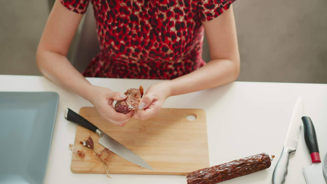 Woman preparing sausage