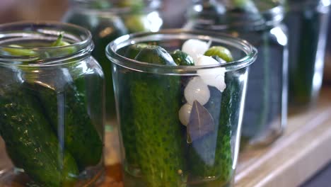 cucumbers are placed in a glass and filled up with broth