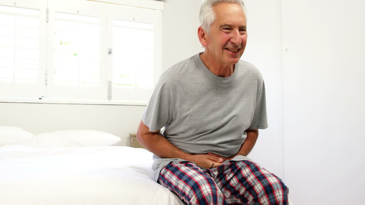 Mature man having stomach pain 