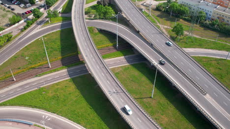 aerial view of cars traveling on maze-like kliniczna interchange, complex network of roads and highways