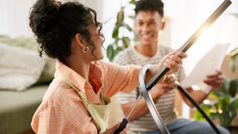 couple assembling furniture together