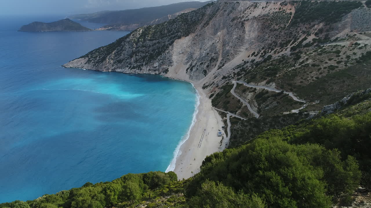 Aerial view on Myrtos Beach with blue water during sunny day