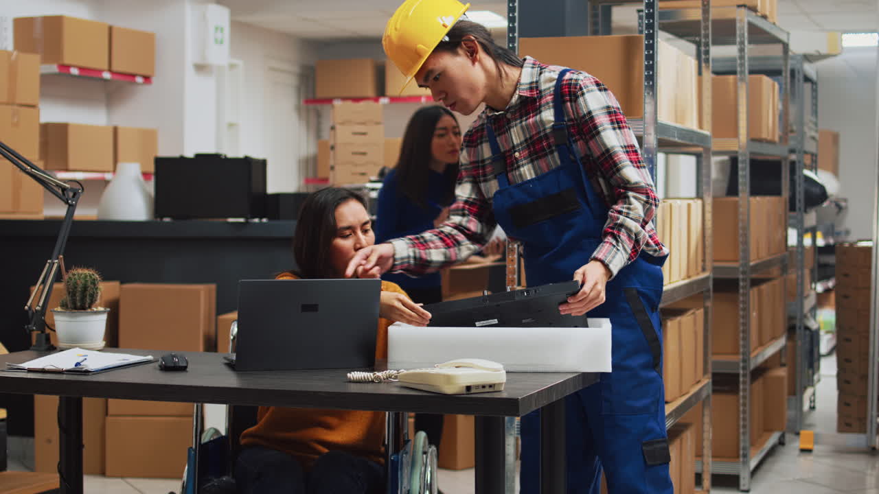 Warehouse workers inspecting package