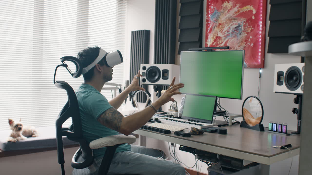 Man putting on a VR headset at home, surrounded by a modern desk setup and dog