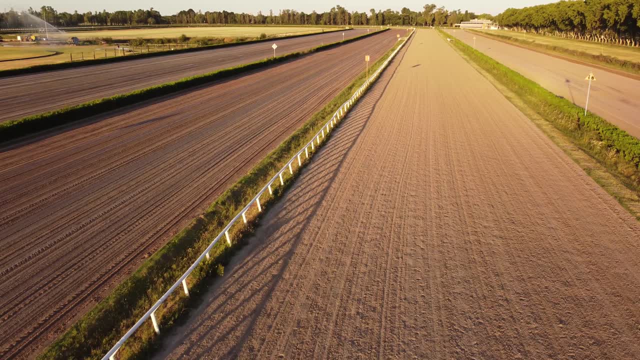 Aerial forward flight over Empty Horse Hipodromo de San Isidro during sunset time