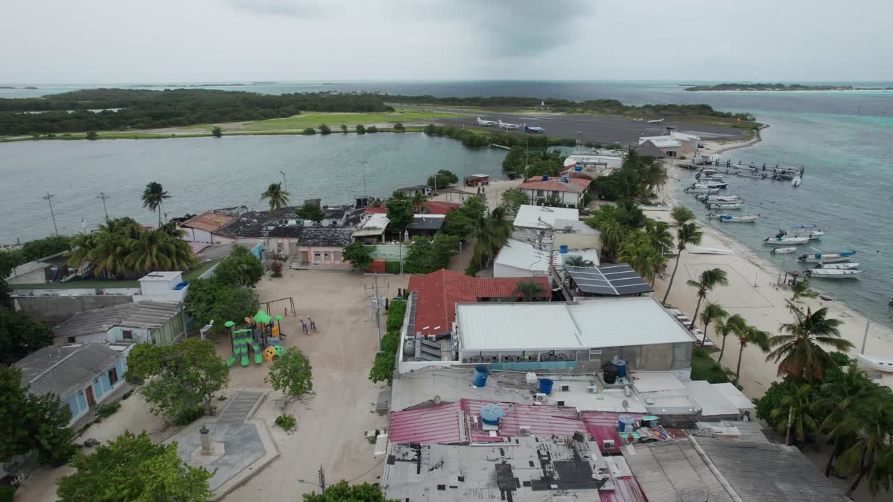 Aerial view of coastal town Los Roques, cloudy sky, peaceful mood