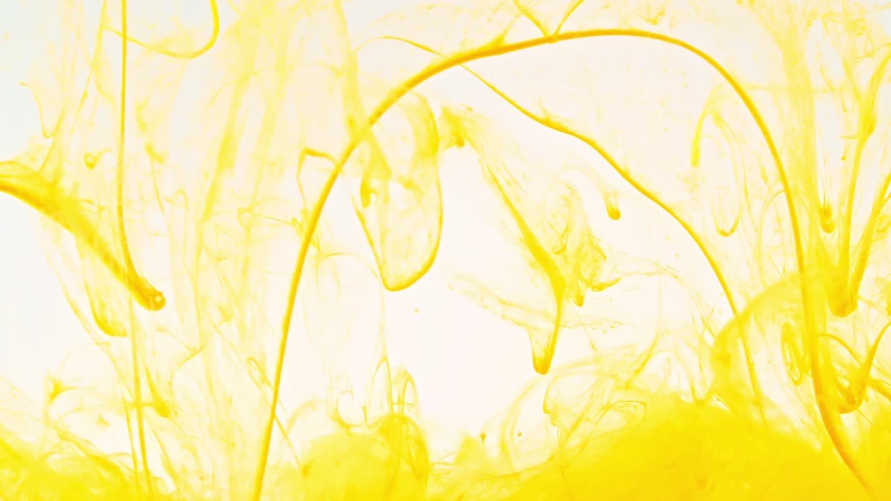 Color ink in water on white background. Paint drops mixing in water, Ink swirling underwater. Colored cloud abstract smoke explosion. Abstract color mix. Macro shot