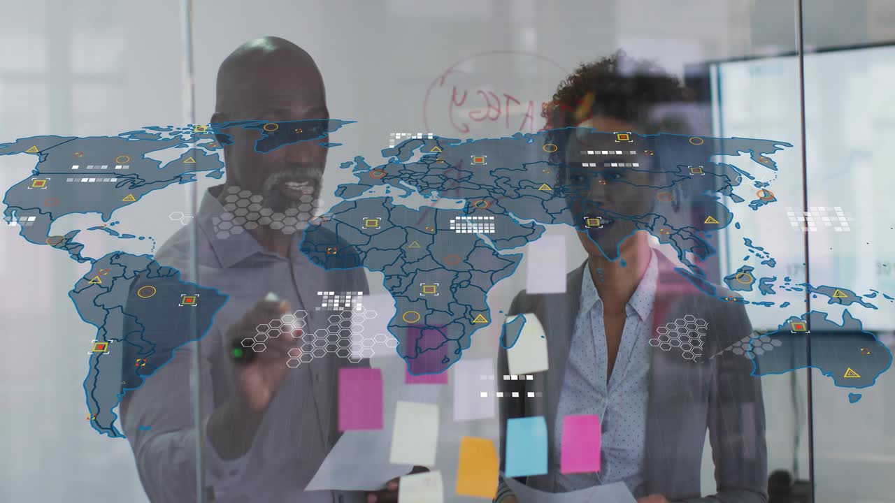 Team gesturing with marker, writing on glass, moving notes while map overlay linking data business