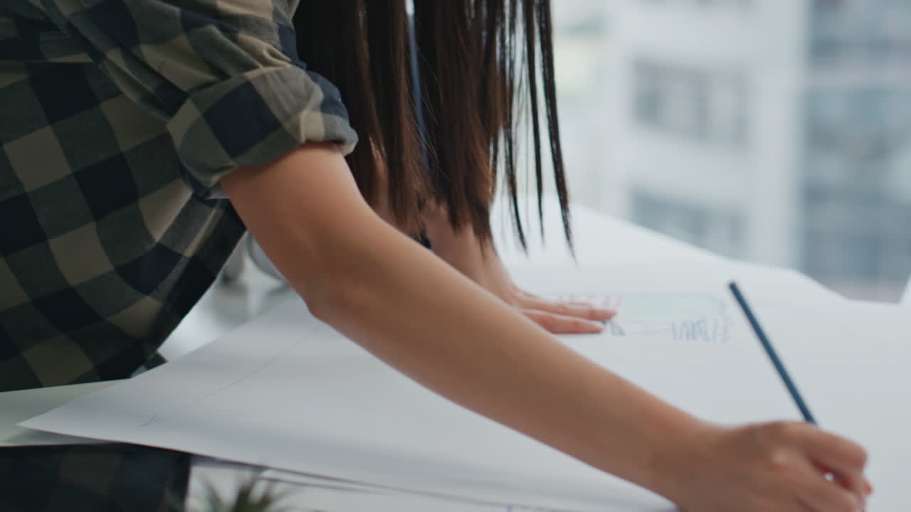 Hipster girl working blueprints remote workplace. Architectural designer drawing